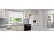 Charming kitchen featuring a refrigerator and natural light with a backyard view at 513 Pauline Dr, Bonneau, SC 29431