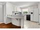 Eat-in kitchen featuring appliances, peninsula, and tile floor at 513 Pauline Dr, Bonneau, SC 29431