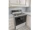 Close-up of white oven with black top, with drawers on the side and cabinets above at 513 Pauline Dr, Bonneau, SC 29431
