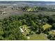 Aerial view of the house surrounded by lush greenery and a marsh at 6434 Saint Anthony Dr, Meggett, SC 29449