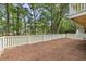 Well-maintained backyard with fresh mulch and a white picket fence, great for outdoor activities at 6434 Saint Anthony Dr, Meggett, SC 29449