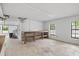 Spacious basement with concrete floor, shelving and natural light, ideal for workshop or storage at 6434 Saint Anthony Dr, Meggett, SC 29449