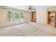Well-lit bedroom with neutral carpet, large windows and private access to deck at 6434 Saint Anthony Dr, Meggett, SC 29449