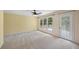 Bright bedroom with neutral carpet, large windows and private access to deck at 6434 Saint Anthony Dr, Meggett, SC 29449