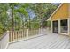 Spacious outdoor deck with white railing, a perfect spot for relaxing and enjoying the lush surroundings at 6434 Saint Anthony Dr, Meggett, SC 29449