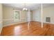 Cozy dining room featuring hardwood floors, natural light and classic lighting at 6434 Saint Anthony Dr, Meggett, SC 29449