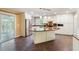 Spacious eat-in kitchen featuring stainless appliances, light cabinetry, and an island with breakfast bar at 6434 Saint Anthony Dr, Meggett, SC 29449