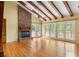 Large living room with brick fireplace and bright natural light at 6434 Saint Anthony Dr, Meggett, SC 29449