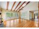 Vaulted living room with exposed beams and a large window view of the outdoors at 6434 Saint Anthony Dr, Meggett, SC 29449