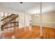 View of the living room with hardwood floors and staircase at 6434 Saint Anthony Dr, Meggett, SC 29449