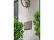 Elegant address sign on a textured wall, framed by lush greenery, denoting '71 East Bay Street' at 71 E Bay St, Charleston, SC 29401