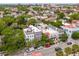 Aerial view showcasing neighborhood of charming townhouses with lush tree coverage throughout at 71 E Bay St, Charleston, SC 29401