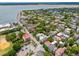 Overhead view of a Charleston neighborhood featuring charming architecture, lush greenery, and waterfront scenery at 71 E Bay St, Charleston, SC 29401