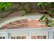 Climbing vines accentuate this arched door in the rear of the home at 71 E Bay St, Charleston, SC 29401