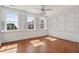 Sunlit bedroom featuring hardwood floors, plantation shutters, and a chandelier at 71 E Bay St, Charleston, SC 29401