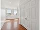 Bright bedroom with hardwood floors, shutters, and a chandelier at 71 E Bay St, Charleston, SC 29401