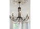 Elegant chandelier with beaded accents, illuminating a bright and airy room at 71 E Bay St, Charleston, SC 29401