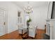 Well lit dining room with hardwood floors, a fireplace, and large window at 71 E Bay St, Charleston, SC 29401
