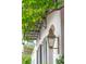 Exterior with a lantern and awning, showcasing architectural details and lush foliage at 71 E Bay St, Charleston, SC 29401