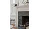 Elegant fireplace with a decorative mantel and black stone surround, complemented by classic interior design at 71 E Bay St, Charleston, SC 29401