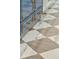 Close up of checkered marble floors and blue kitchen cabinets with gold hardware at 71 E Bay St, Charleston, SC 29401