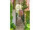 Ornate wrought iron gate leads to the residence's garden and grounds at 71 E Bay St, Charleston, SC 29401