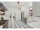 Charming renovated kitchen with a professional stove and checkered floors at 71 E Bay St, Charleston, SC 29401