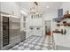 Bright kitchen featuring stainless steel appliances, custom cabinets, light fixtures, and luxury marble checkerboard flooring at 71 E Bay St, Charleston, SC 29401