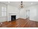 Spacious living room with hardwood floors, fireplace, and ample natural light at 71 E Bay St, Charleston, SC 29401