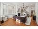 Elegant living room featuring hardwood floors, a fireplace, a staircase, and natural light at 71 E Bay St, Charleston, SC 29401