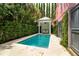 An intimate plunge pool is tucked away beside a charming gazebo and manicured hedges at 71 E Bay St, Charleston, SC 29401