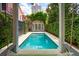 Tranquil backyard pool with an attached spa and lush landscaping at 71 E Bay St, Charleston, SC 29401