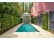 Plunge pool sits beside a gazebo and manicured hedges in the backyard of this home at 71 E Bay St, Charleston, SC 29401