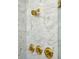 Elegant shower featuring marble tile and gold fixtures at 71 E Bay St, Charleston, SC 29401