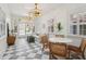 Sitting room with checkered floors, white sofa, and a view to the pool through the French doors at 71 E Bay St, Charleston, SC 29401