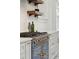 Close up on blue professional stove with gold knobs and marble countertops at 71 E Bay St, Charleston, SC 29401