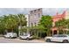 Charming Charleston home with a colorful facade, lovely landscaping, and curb appeal at 71 E Bay St, Charleston, SC 29401