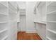 Spacious walk-in closet with ample storage and wood floors at 71 E Bay St, Charleston, SC 29401