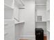 Bright walk-in closet with custom shelving and a security safe at 71 E Bay St, Charleston, SC 29401