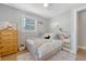 Bedroom with a cozy rug, large window, dresser and fun decor at 7639 Hillandale Rd, North Charleston, SC 29420