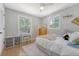 Comfortable bedroom with two large windows, a work desk, and plenty of natural light at 7639 Hillandale Rd, North Charleston, SC 29420