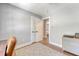 Spare bedroom provides a well-lit desk area, stylish rug, and access to the living area at 7639 Hillandale Rd, North Charleston, SC 29420