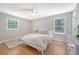 Bright bedroom with hardwood floors, bed, and an abundance of natural light at 7639 Hillandale Rd, North Charleston, SC 29420