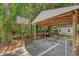 Backyard carport with a basketball hoop for recreational enjoyment at 7639 Hillandale Rd, North Charleston, SC 29420