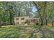 Charming two-story home with brick accents, well-manicured lawn, and mature trees at 7639 Hillandale Rd, North Charleston, SC 29420