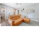 Comfortable living room featuring a brown leather sofa, and curated gallery wall at 7639 Hillandale Rd, North Charleston, SC 29420