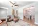 Open-concept living area with hardwood floors, modern decor, and seamless transition to the dining room at 7639 Hillandale Rd, North Charleston, SC 29420