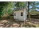 This backyard features a well-maintained storage shed, offering ample space for gardening tools and outdoor equipment at 7639 Hillandale Rd, North Charleston, SC 29420