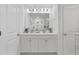 Bright bathroom with dual sink vanity, modern lighting, and a tiled shower at 768 Trotters Ln, Moncks Corner, SC 29461