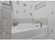 Relaxing bathroom showcases a luxurious soaking tub with marble tile surround at 768 Trotters Ln, Moncks Corner, SC 29461